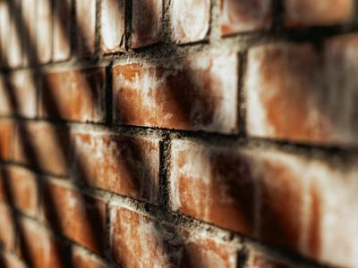 Abstract green light beam reflecting on a dark wall