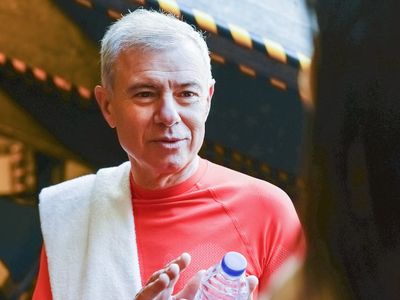 Water bottle and towel in a gym setting